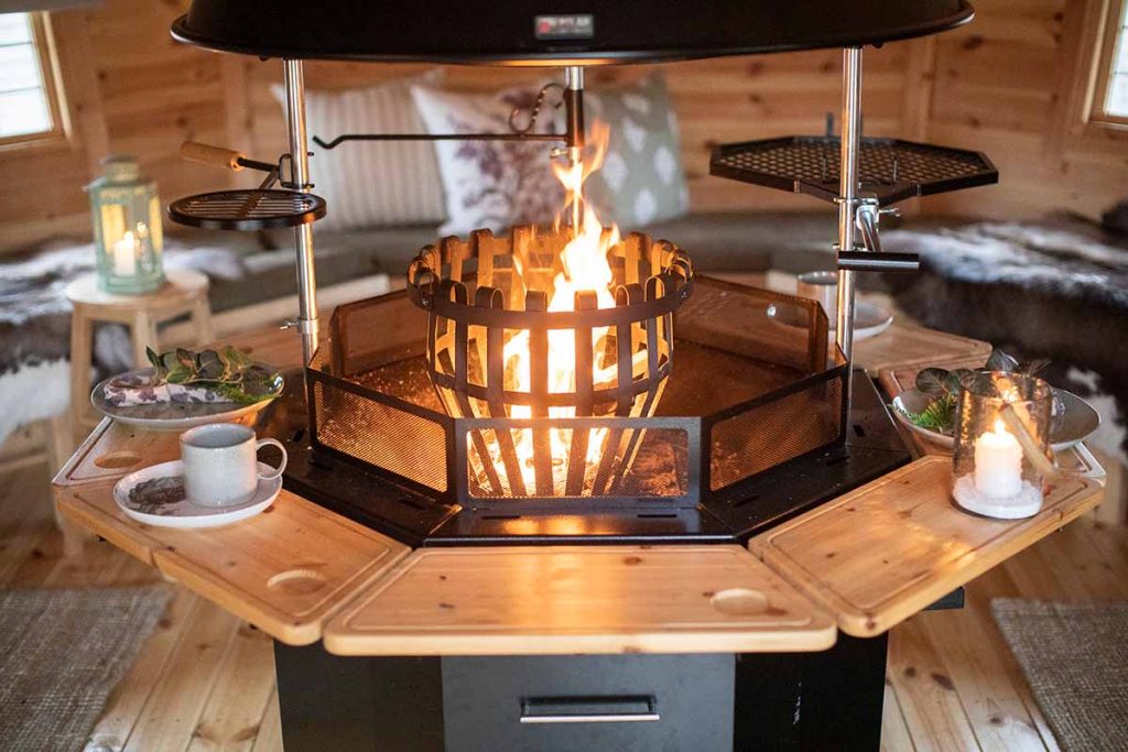 log brazier alight in a bbq cabin
