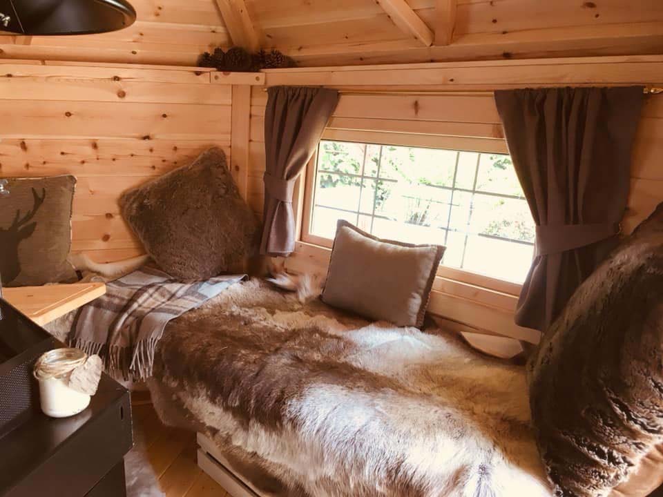 window dressed with seat cushions in grill hut