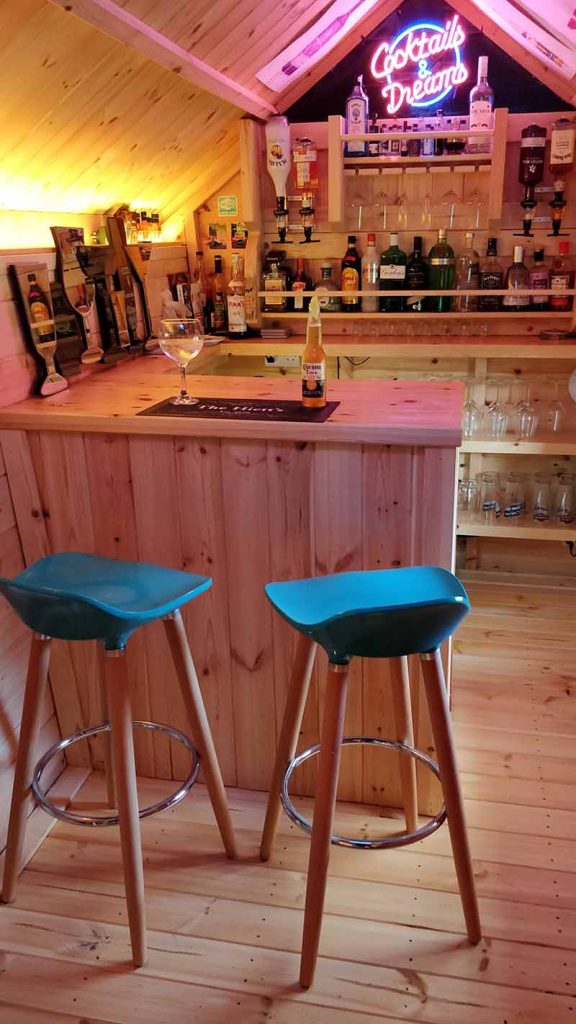 bar with bar stools in a barbecue hut