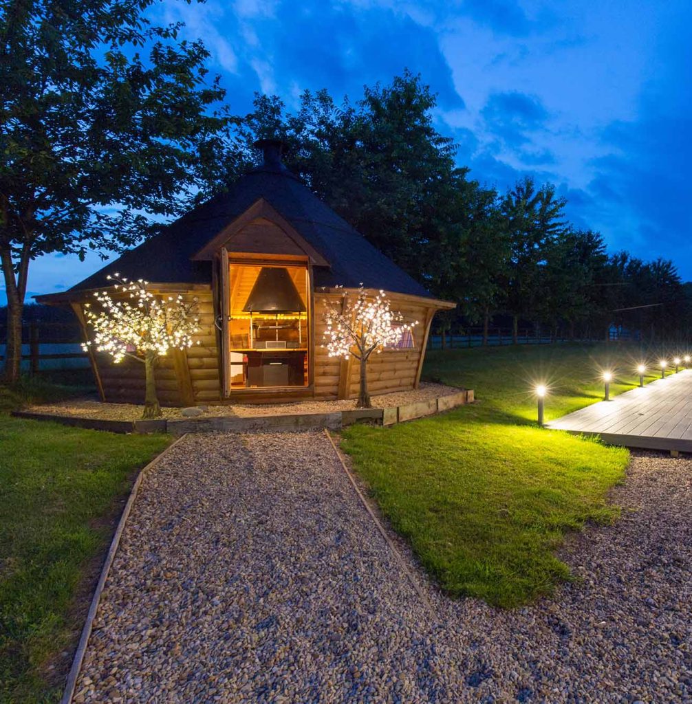 bbq hut at night with lights on