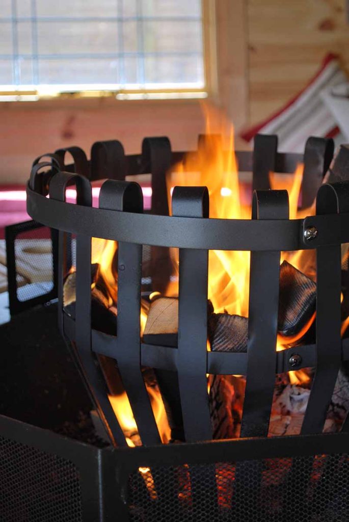 log brazier with burning wood